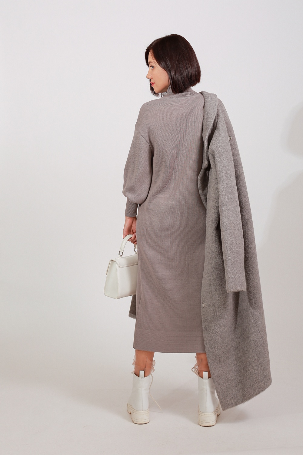 Dress knitted with a high neck from a merino wool